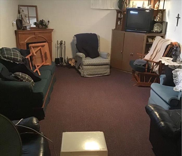 Tight family room with a dehumidifier in the room and dry carpets.