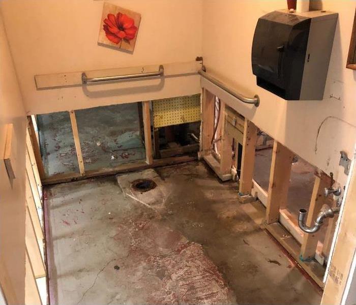 A bathroom that is gutted out.