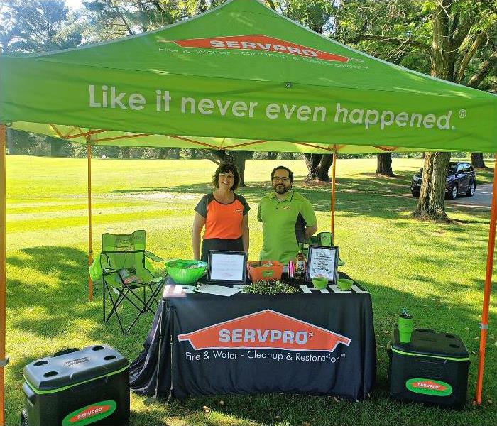 SERVPRO employees at golf tent set up 