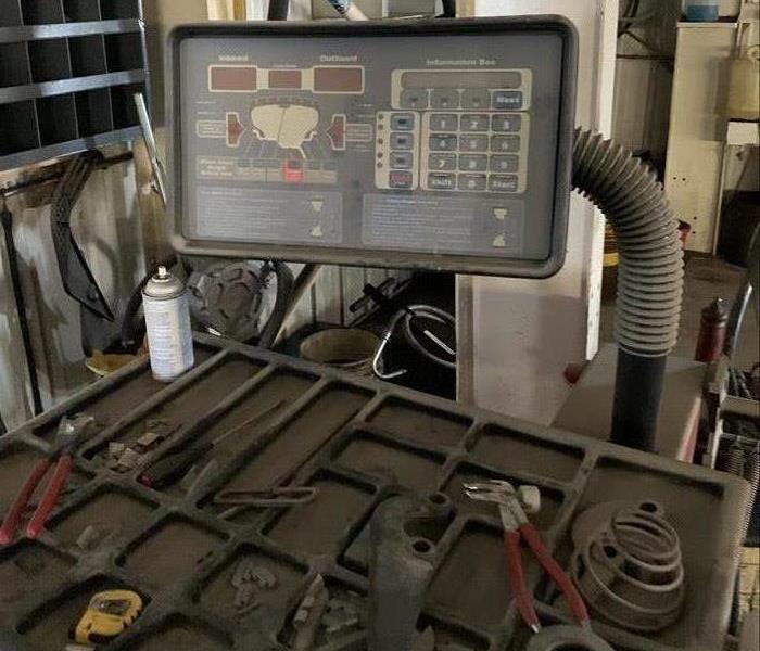 Mechanic Equipment with a large tool box and tools on the table.